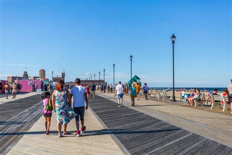 people walking on boardwalk in asbury park nj