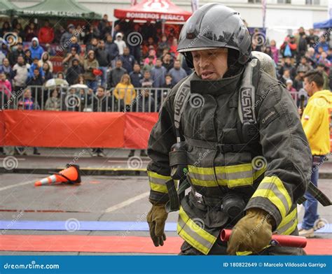 A Firefighter In Uniform And Helmet Uses Foam . Editorial Photo ...