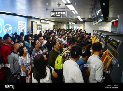 Crowd of passengers wait up to board at a train station in Chengsu, southwest Chinas Sichuan ...