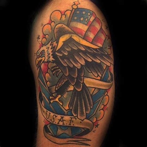 an eagle and flag tattoo on the arm