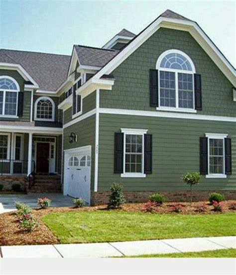 White steel, carriage house garage doors with windows, adds a bright ...