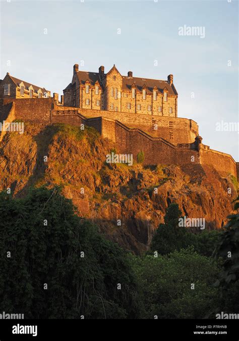 Edinburgh castle on the Castle Rock at sunset Stock Photo - Alamy