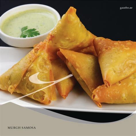 Triangular, flaky pyramid shaped pastry stuffed with chicken mince ...