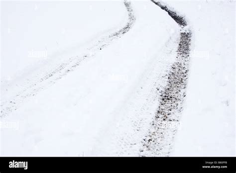 Tractor tracks in the snow Stock Photo - Alamy