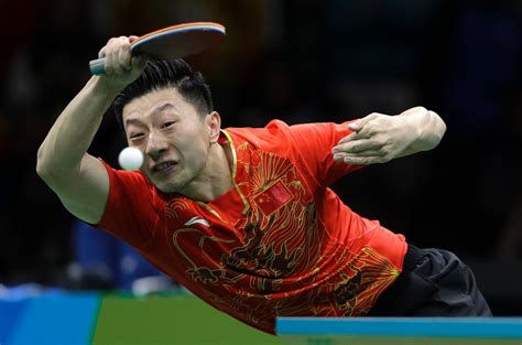 Ma Long, of China, returns a shot to Zhang Jike, of China, during the men's… | Atleta