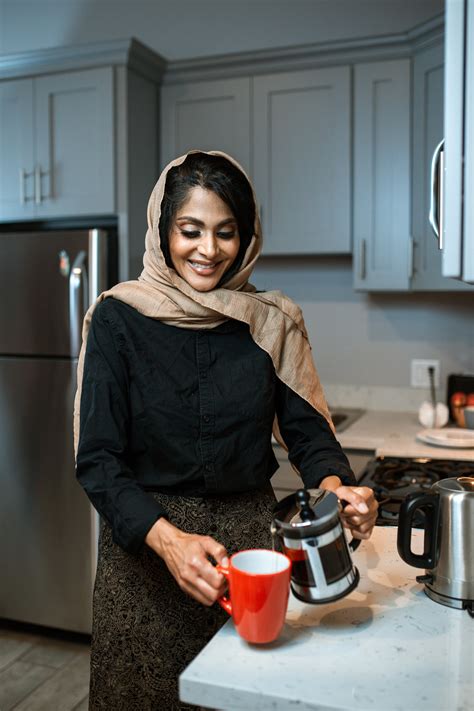 Photo of Person Pouring Coffee in Mug · Free Stock Photo