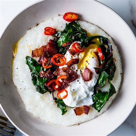 Cheesy Grits with Poached Eggs, Greens, and Bacon Recipe | Bon Appétit