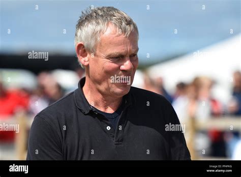 Beaminster, Dorset, UK. 19th August 2018. UK Weather. Actor Martin Clunes judging a dog show ...