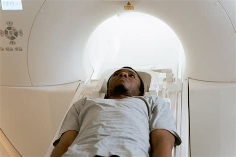 Photo Of Doctor Operating MRI Scanner · Free Stock Photo