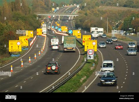 Lane closure signs on dual carriageway for road works and infrastructure repairs Stock Photo - Alamy