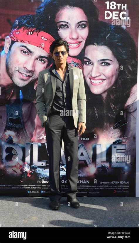 Bollywood actor Shah Rukh Khan standing in front of film Dilwale poster in New Delhi, India ...