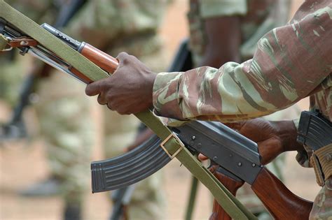 File:Beninese Army soldier racks his AK-47 at Bembèrèkè 2009-06-16.jpg - Wikimedia Commons