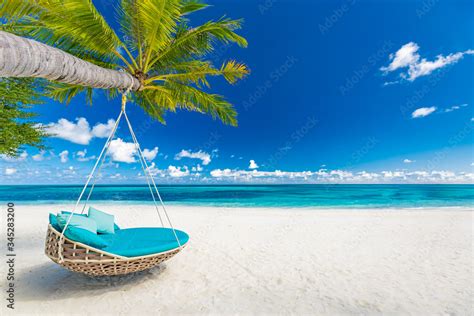 Tropical beach paradise as summer landscape with beach swing or hammock ...