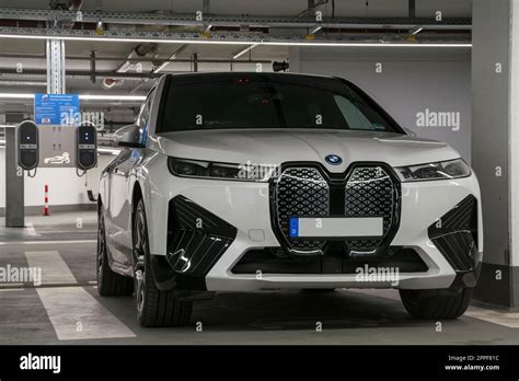 BMW IX in underground parking lot while charging Stock Photo - Alamy