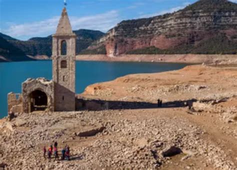 11th century church emerges from dried-up reservoir as Catalonia ...