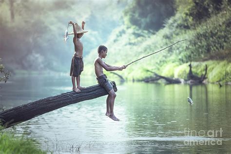 Boy fishing at the river Photograph by Sasin Tipchai - Pixels