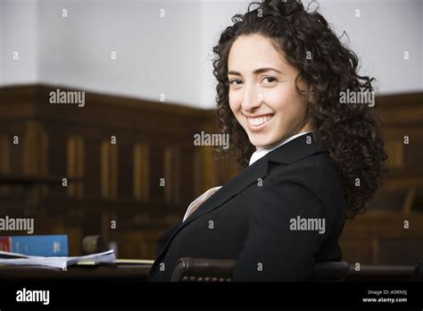 Female lawyer smiling in courtroom Stock Photo - Alamy