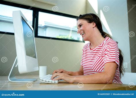 Smiling Woman Laughing at Her Computer Stock Image - Image of mouse, blue: 66933501