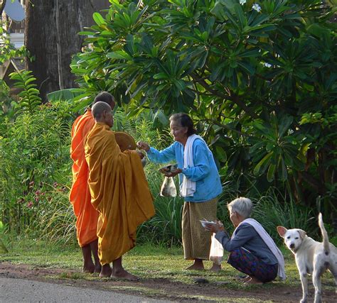 Buddhist monks on the morning alms round. | Smithsonian Photo Contest | Smithsonian Magazine