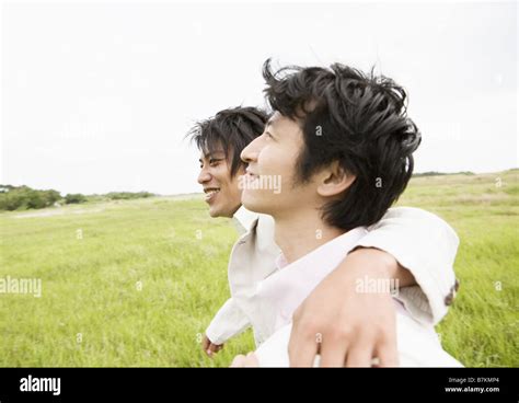 Two young men smiling Stock Photo - Alamy