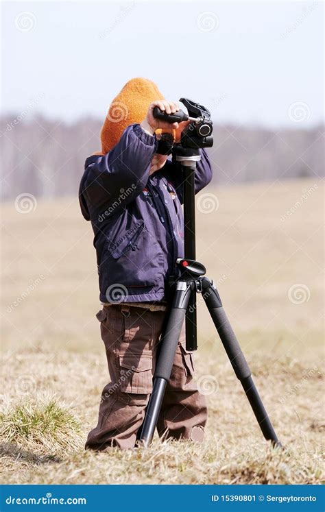 Young Photographer with Tripod Stock Image - Image of lawn, playground: 15390801