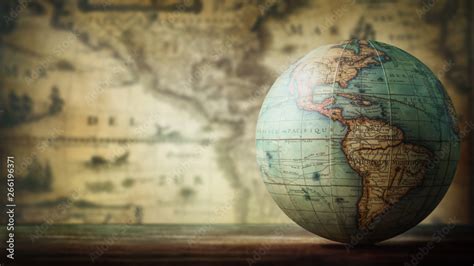 Old globe on vintage map background. Selective focus. Travel, stories ...