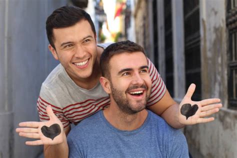 Gay Interracial Couple On Valentines Day With A Heart Stock Photos, Pictures & Royalty-Free ...