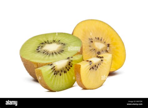 Green and yellow kiwi or kiwifruit halved and sliced Stock Photo - Alamy