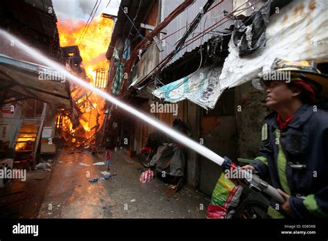 Quezon City Philippines 1st Jan 2015 A Firefighter Tries To Put Out