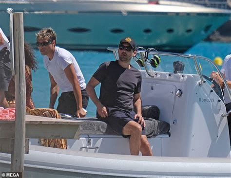 Leonardo DiCaprio And Pal Tobey Maguire Arrive With Bikini Clad Babe Via Speedboat On The Beach