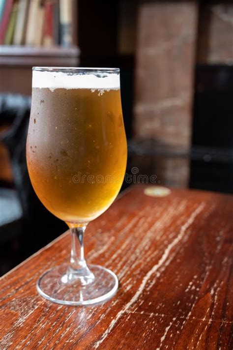 Pint Glass Of British Light Pilsner Ot Lager Beer Served In Old Vintage