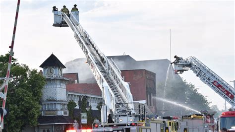 As Flames Lap At Historic Downtown Holly Residents Vow To Rally Around