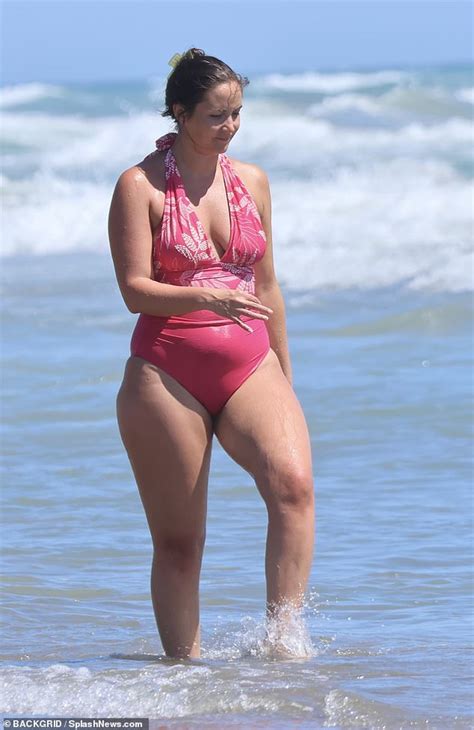 Jacqueline Jossa Showcases Her Incredible Figure In A Hot Pink Swimsuit As She Hits The Beach