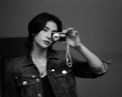 Black And White Photograph Of A Woman Taking A Selfie With Her Cell