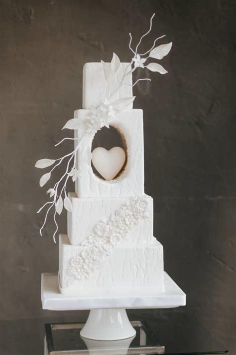 Romantic White Textured Wedding Cake With Heart Cutout And Sugar