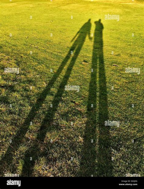 Shadow of a couple holding hands Stock Photo - Alamy