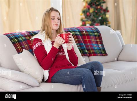 Cheerful Cute Blonde Sitting On Couch Holding Mug Stock Photo Alamy