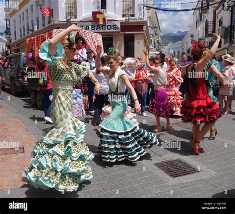 Women And Girls Dressed In Traditional Costume Flamenco Dancing In The