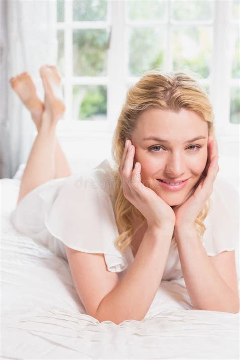 Pretty Blonde Lying On Bed Smiling At Camera Stock Photo Image Of View Spare