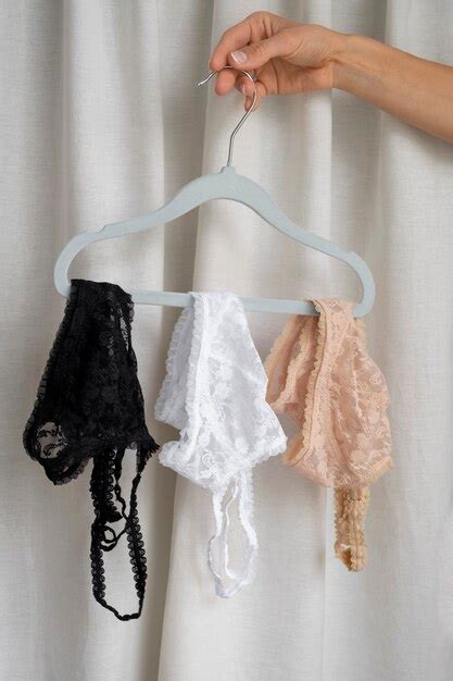 Free Photo Hand Holding Female Lingerie Still Life