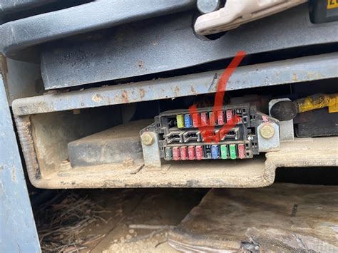 Where is the fuse box on a Takeuchi TB235, while running engine shut