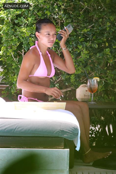 Karrueche Tran Sexy Shows Off Her Hot Figure In A Pink Bikini As She Relaxes By The Pool In