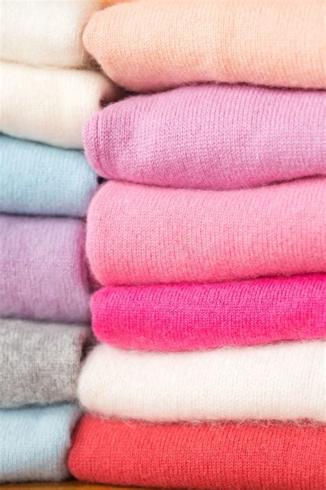 A Stack of Knitted Sweaters of Different Colors Lies. Stock Photo ...