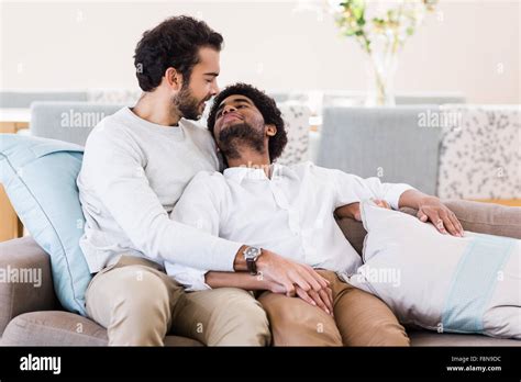 Happy Gay Couple Relaxing On Sofa Stock Photo Alamy