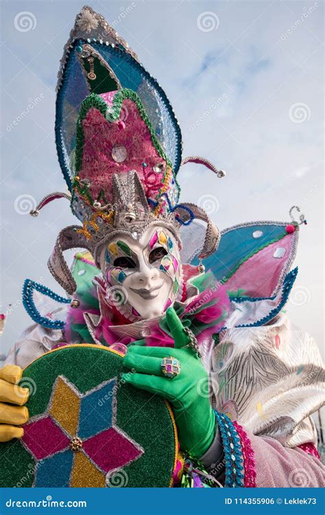 Man In Brightly Colored Jester`s Costume And Mask At Venice Carnival