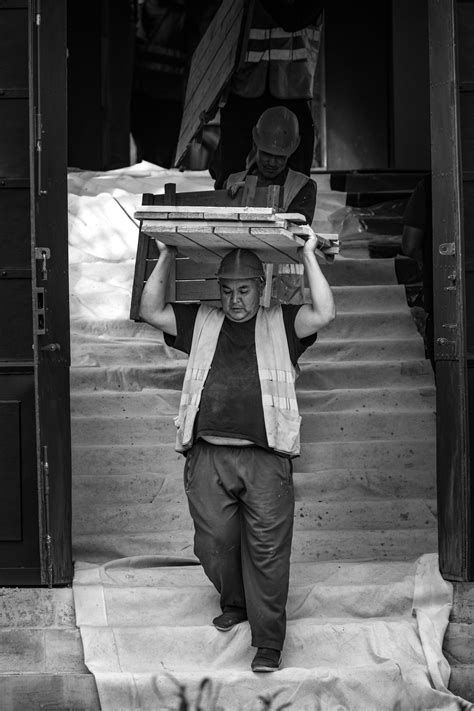Men in Helmets Working on Scaffolding on Building Site · Free Stock Photo