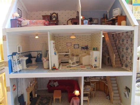 A Doll House Is Shown With Furniture And Accessories