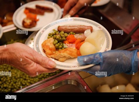 Serving Hot School Dinners In A Primary School Canteen Wales UK Stock Photo Alamy
