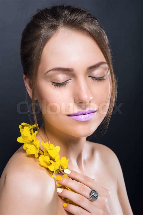 Сlose portrait of beautiful naked girl with bright makeup and flowers Stock image Colourbox