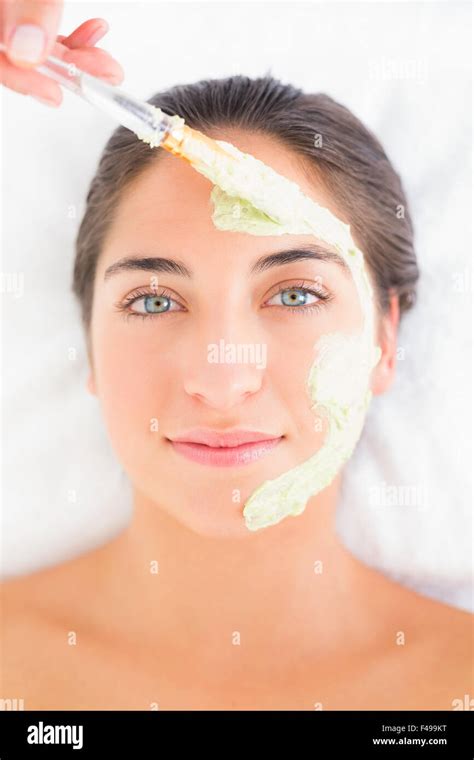 Beautiful Brunette Getting A Facial Treatment Stock Photo Alamy